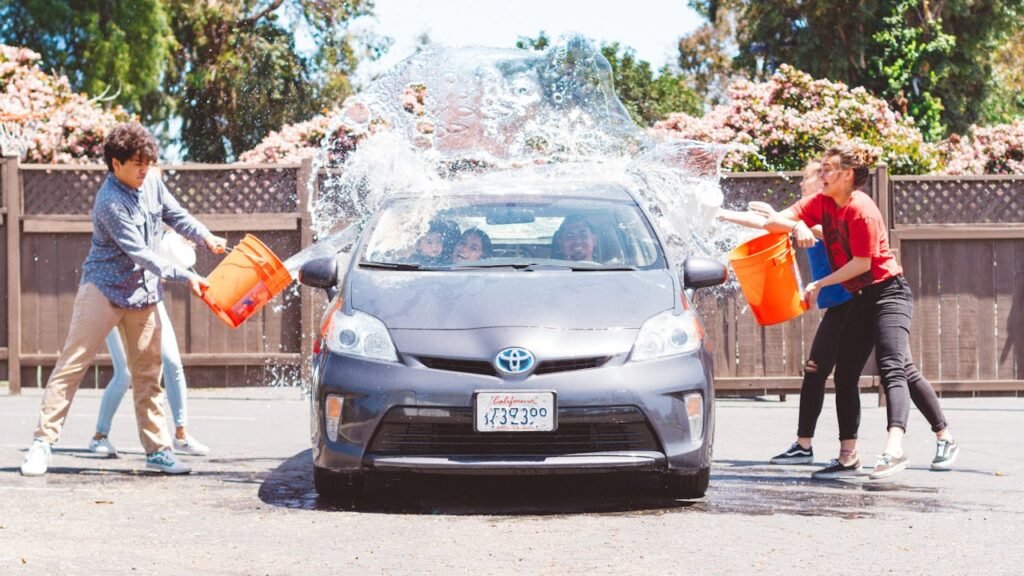 Four Children Washing Silver Toyota Prius